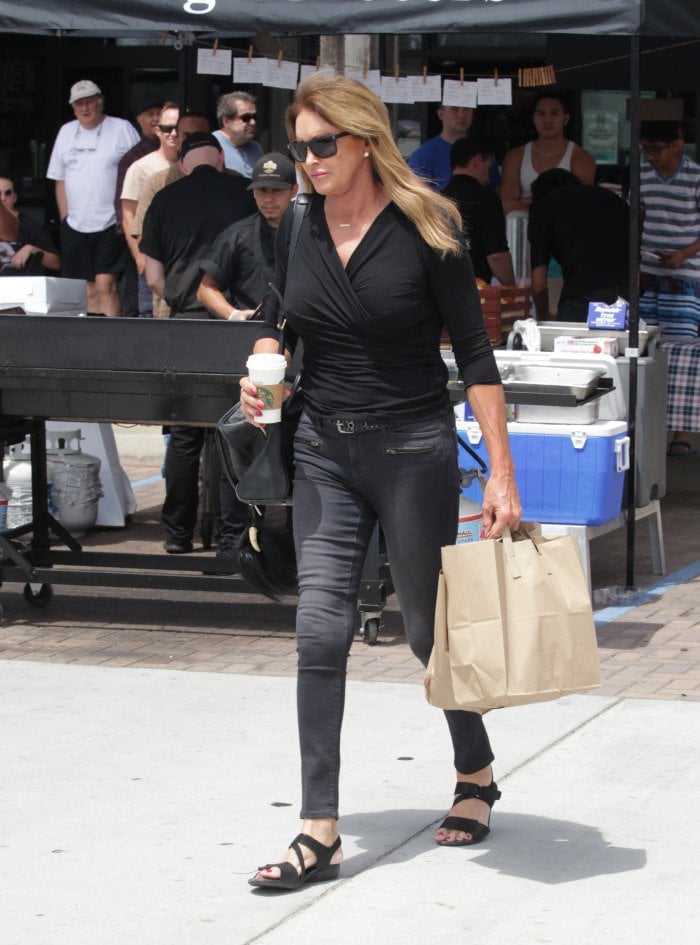 Caitlyn Jenner wears a black top and tight skinny jeans while out shopping in Malibu