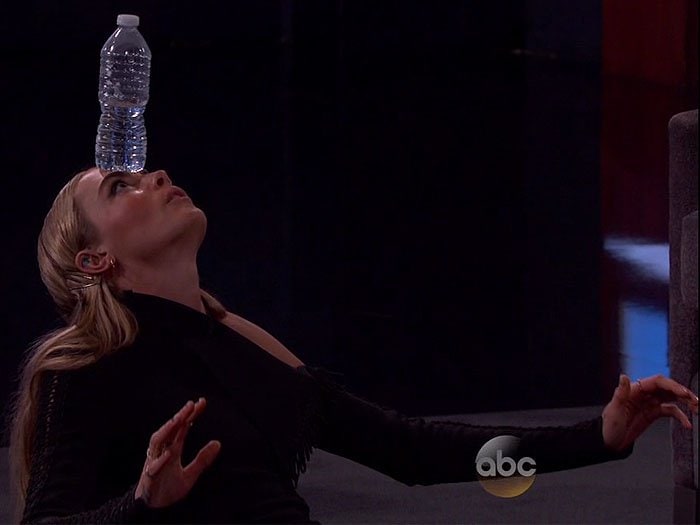 Cara Delevingne balances a water bottle on her forehead on an episode of "Jimmy Kimmel Live!"