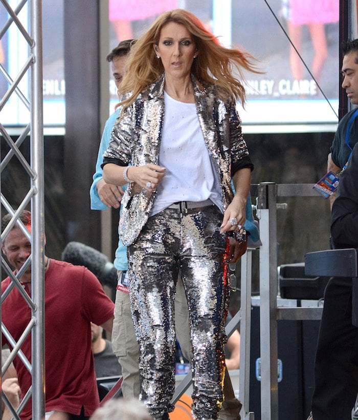 With her sleeves rolled up to reveal a plain white shirt, Celine Dion exuded confidence and professionalism as she captivated the thousands in attendance