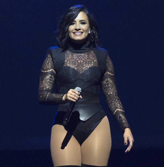 Demi Lovato in a sexy black lace bodysuit