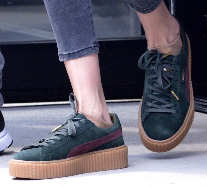 Gigi Hadid wears green Puma by Rihanna sneakers