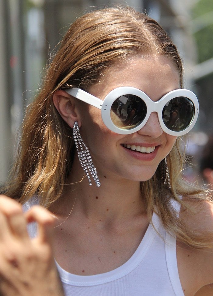 Gigi Hadid hides her eyes behind retro-inspired white-framed sunglasses