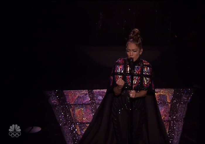 Jennifer Lopez performs in a Michael Cinco jumpsuit and 20-foot stained glass cape