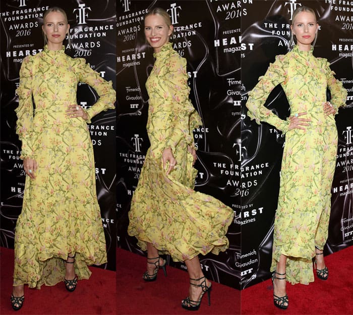 Karolina Kurkova attended the 2016 Fragrance Foundation Awards in a yellow, green, and pink floral Erdem Spring 2016 dress featuring long sleeves and ruffled panels, with a slight high-low hem, paired questionably with heavy black sandals