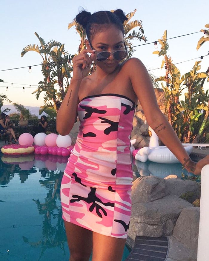 Karrueche Tran taking a poolside photo