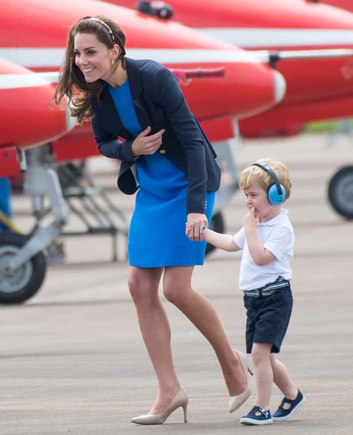 Kate Middleton elevated the dress's structure by layering it with a cherished blue blazer from Smythe