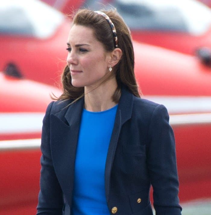 Not to be overlooked, a dainty headband made its appearance, taming Kate Middleton's flowing tresses amidst the whims of the wind