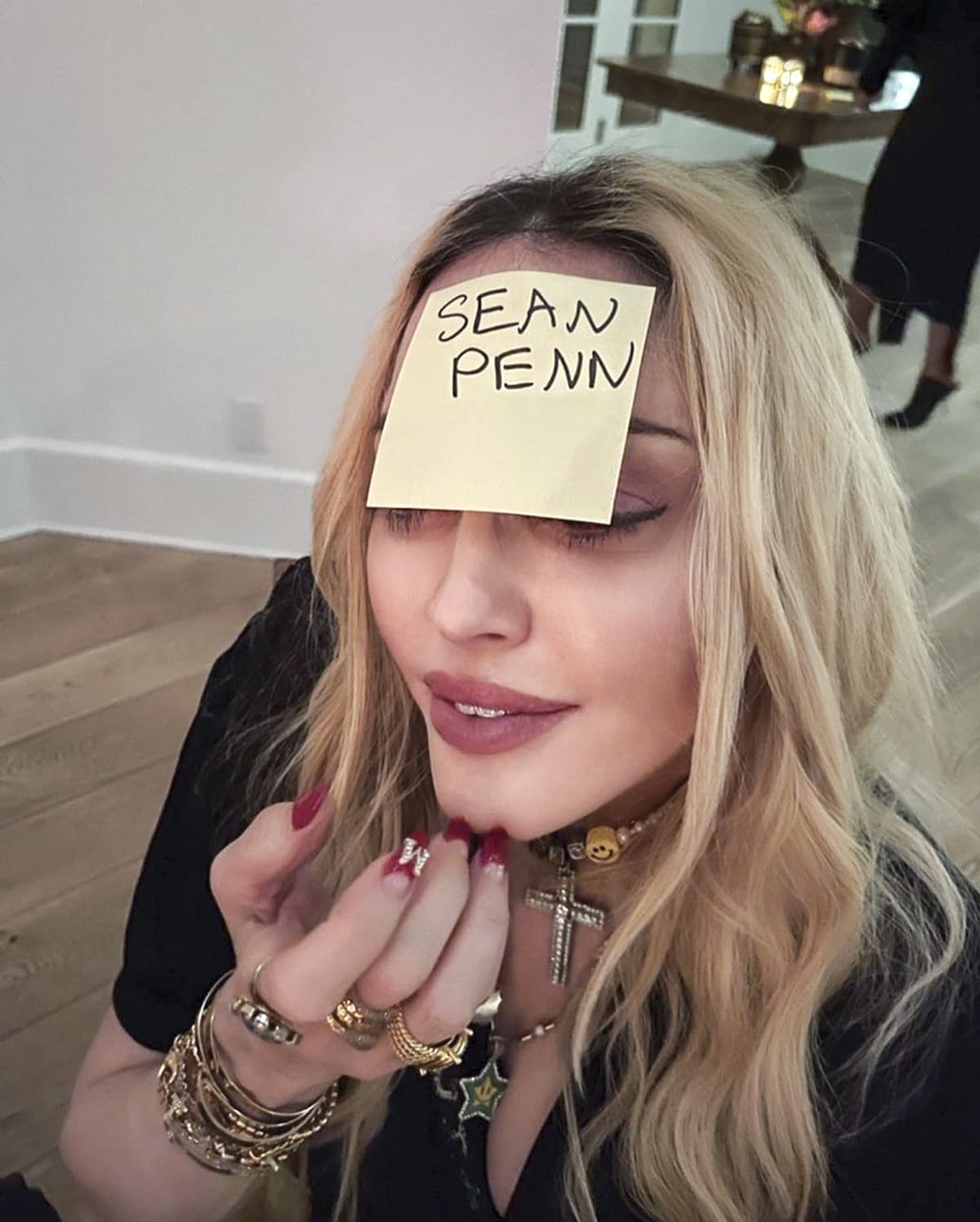 Madonna has her ex-husband Sean Penn's name written on her head on a Post-It Note during a round of Forehead Detective in October 2021