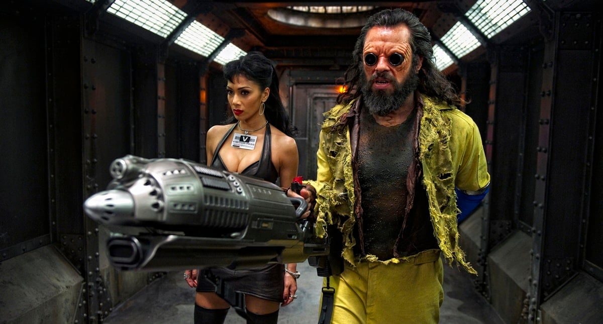 Jemaine Clement as Boris the Animal and Nicole Scherzinger as his girlfriend, Lilly Poison, in the 2012 American science fiction action comedy film Men in Black 3 (stylized as MIB³)