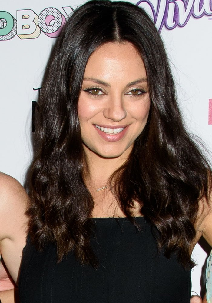 Mila Kunis wears her dark hair down at the "Bad Moms" Mamarazzi screening