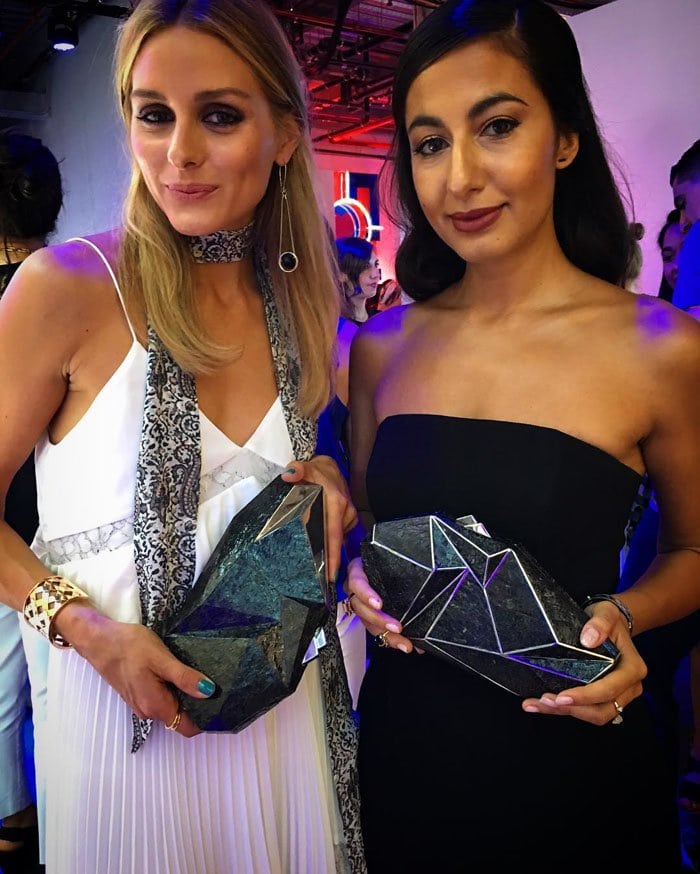 Olivia uploads a photo of herself twinning Nathalie Trad clutches with stylist Nausheen Shah