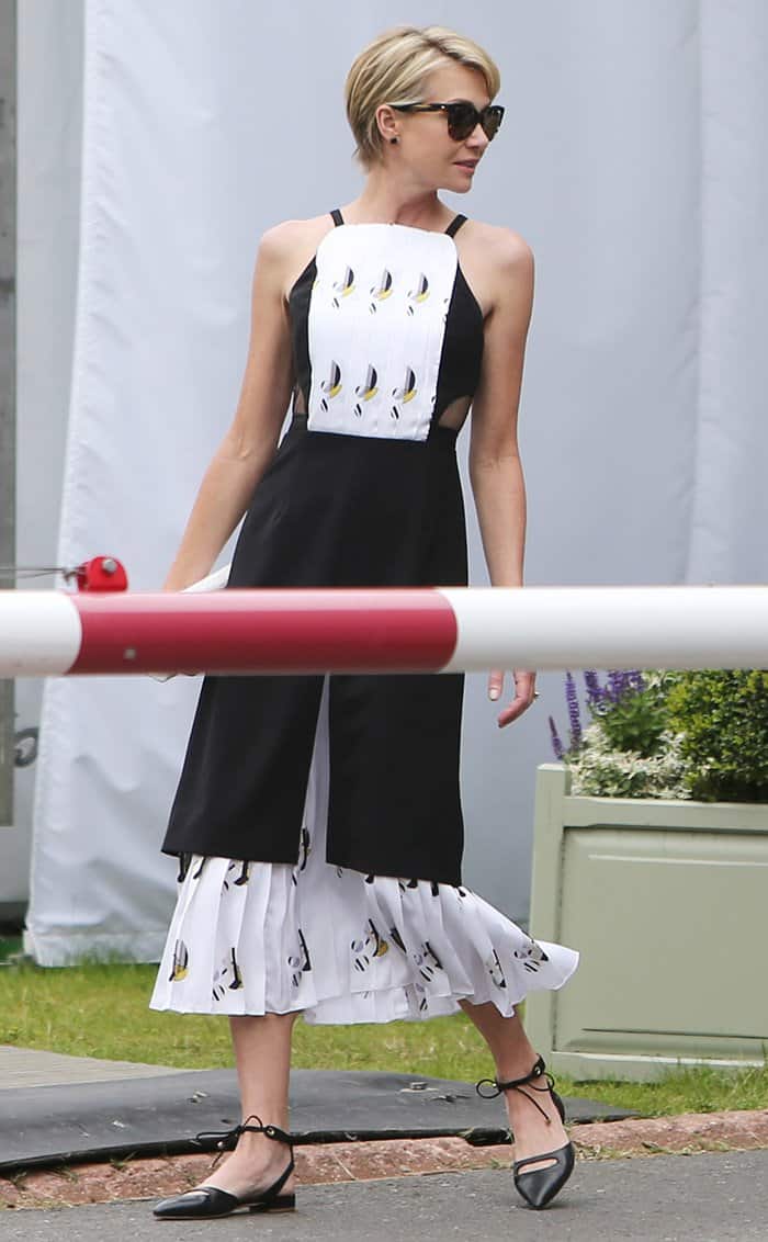 Portia de Rossi completes her Wimbledon look with elegant black ankle-strap flats that add a touch of effortless sophistication to her outfit