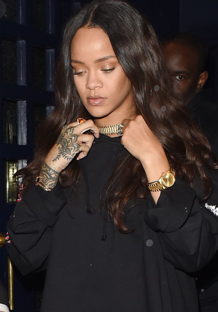 Rihanna keeps her hair down as she leaves Tramps nightclub June 30, 2016 in London