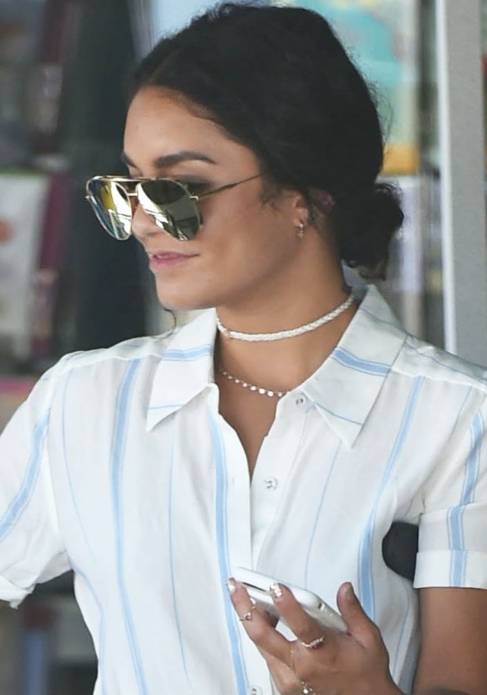 Vanessa Hudgens ties her hair back while shopping at both Bed Bath & Beyond and Whole Foods