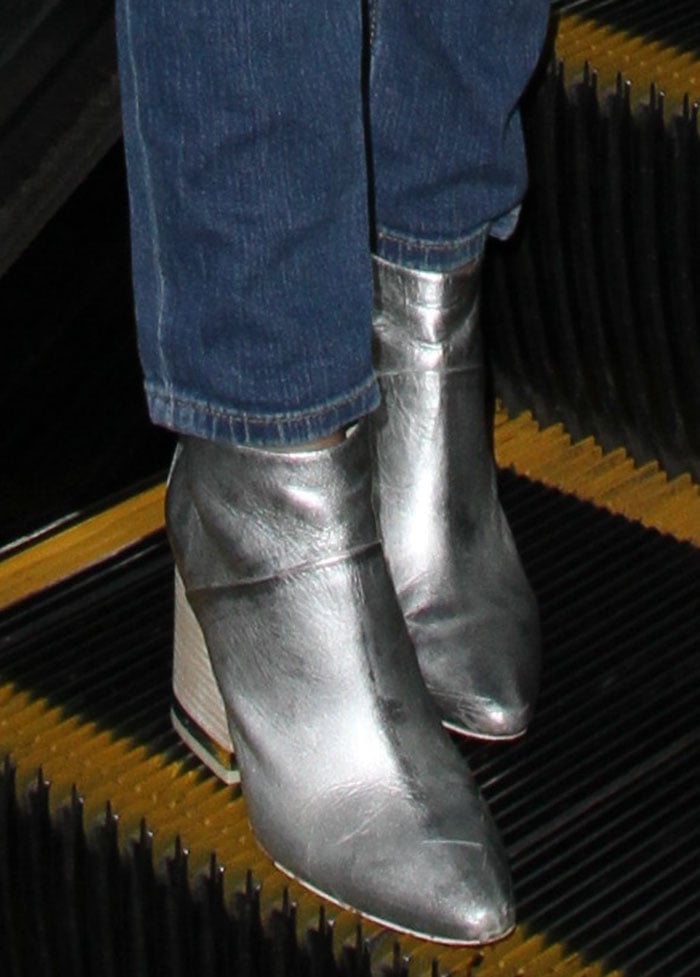 Victoria Justice wears metallic Ash boots at LAX