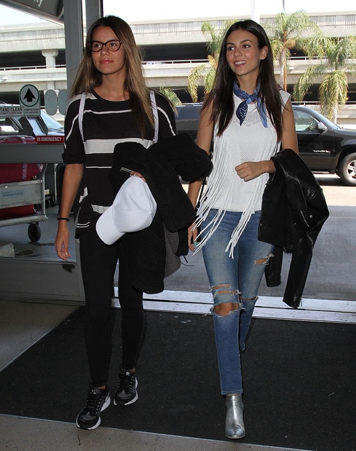 Madison Reed and Victoria Justice arrive at the Los Angeles International Airport