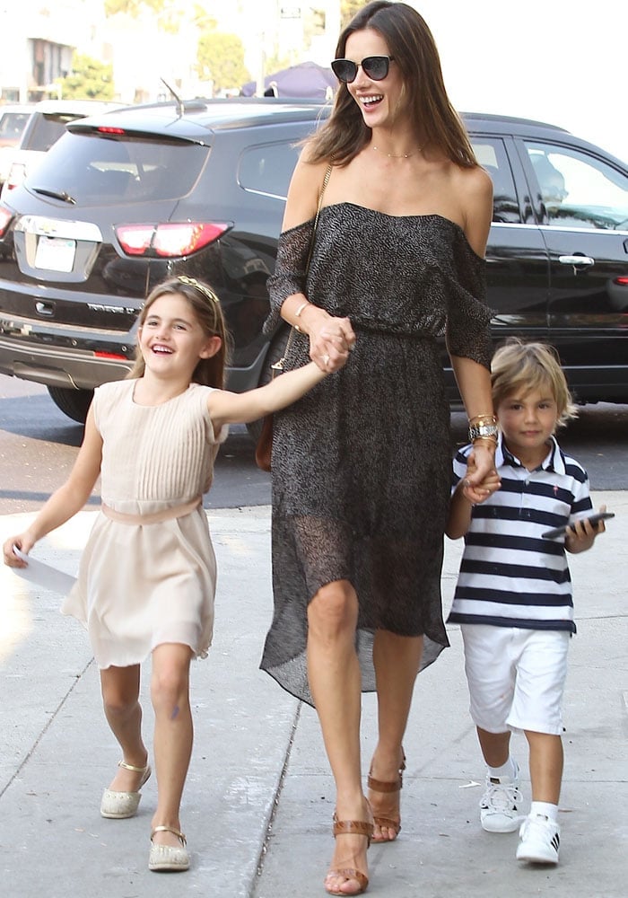 Alessandra Ambrosio wears a Camilla and Marc dress as she escorts her children to her daughter's birthday party in Los Angeles