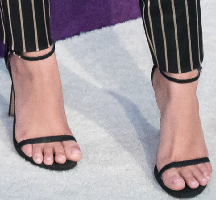 Ariel Winter's feet in black goosebump leather Stuart Weitzman sandals