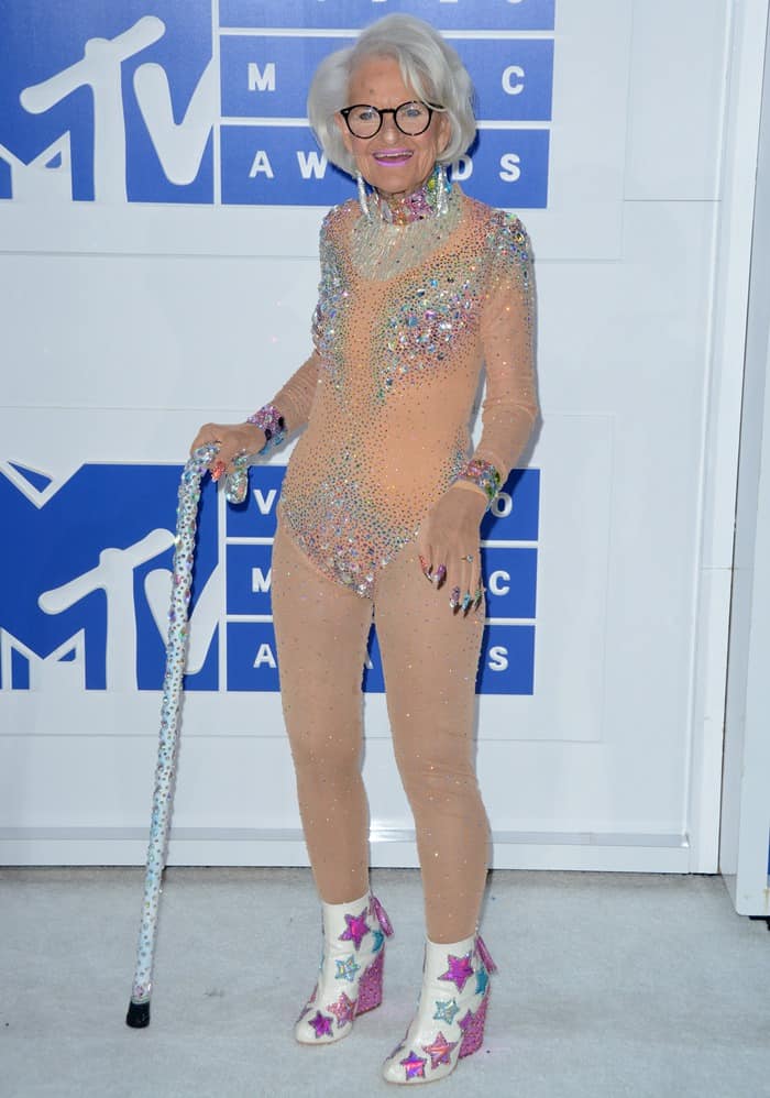 Baddie Winkle carries a bedazzled cane as she attends the MTV VMAs