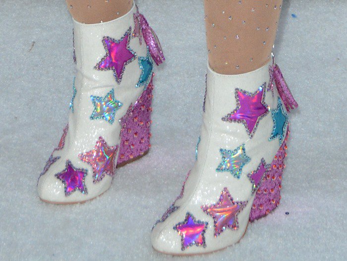 Baddie Winkle wears star-embellished white wedge boots