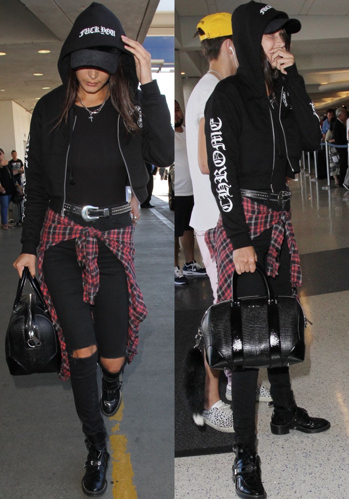 Bella Hadid wears a black Chrome Hearts hoodie as she strolls through LAX with her family 