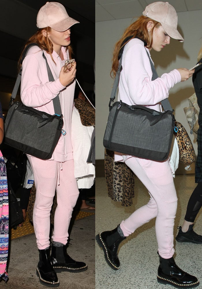 Bella Thorne wears a matching two-piece pink tracksuit as she arrives at LAX