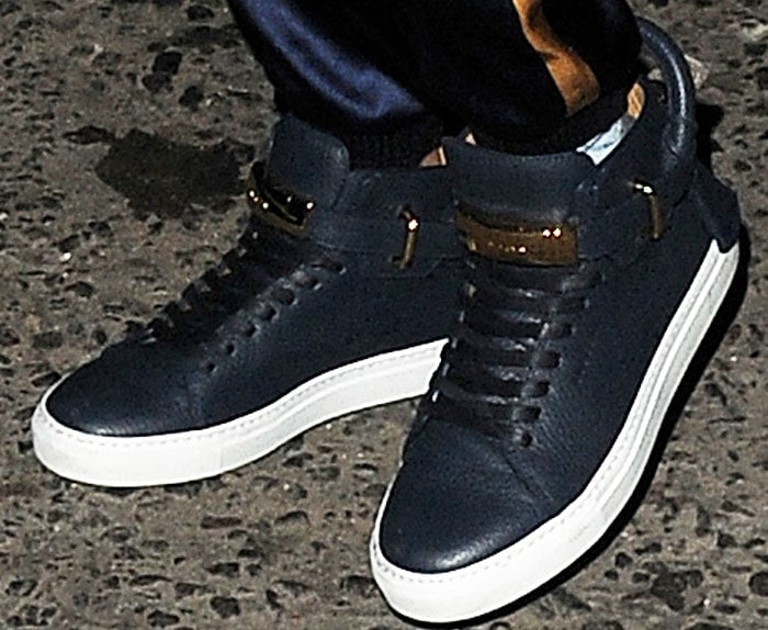 Cara and Margot wear matching Buscemi high top sneakers in navy blue