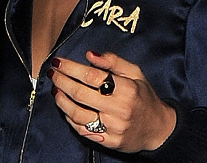 Cara Delevingne shows off some bling with her customized tracksuit by Chaos