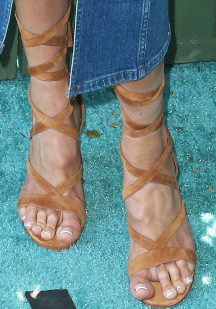 Denim and suede: Cat Deeley shows off her feet in Gianvito Rossi lace-up sandals