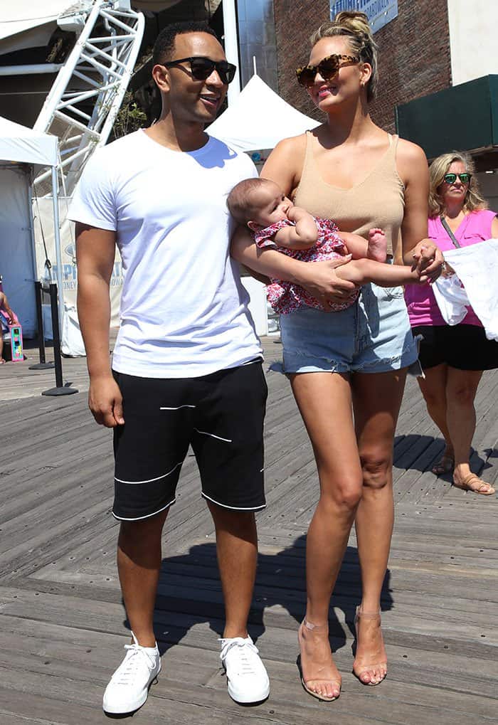 Chrissy Teigen, John Legend and baby Luna Simone at the 2016 Sports Illustrated Summer of Swim Fan Festival & Concert at Coney Island Boardwalk in New York City on August 28, 2016