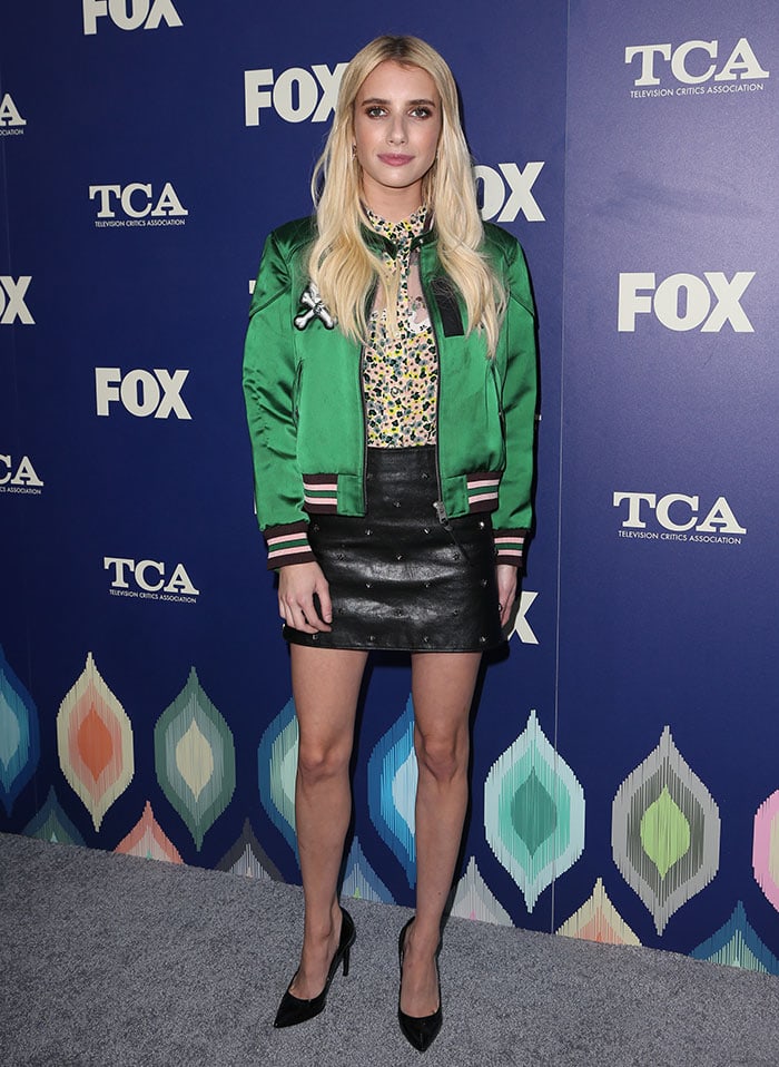 Emma Roberts wears a bright green bomber jacket from the Coach 1941 Resort 2017 collection