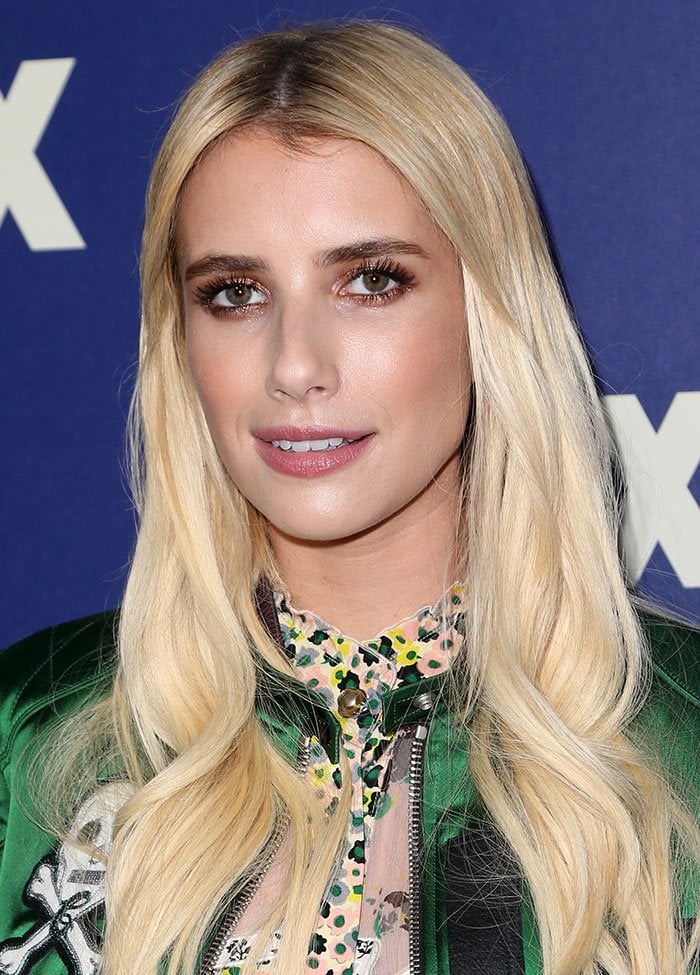 Emma Roberts wears her blonde hair down in curls as she attends the FOX Summer TCA Press Tour