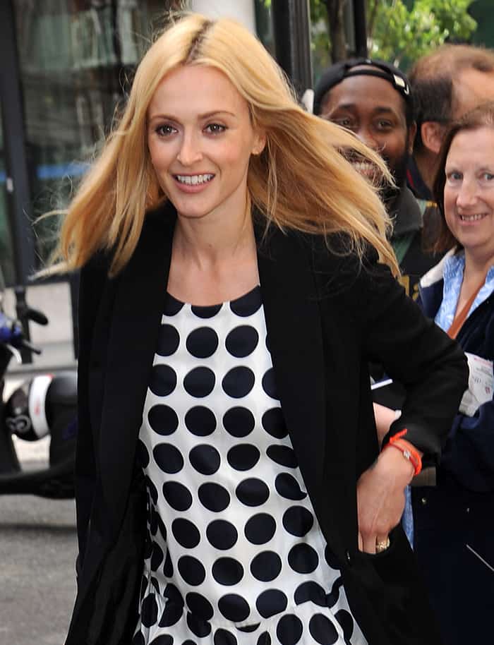 Fearne Cotton elevated her outfit by draping a sleek black blazer over the dress while leaving BBC Radio 2 in London