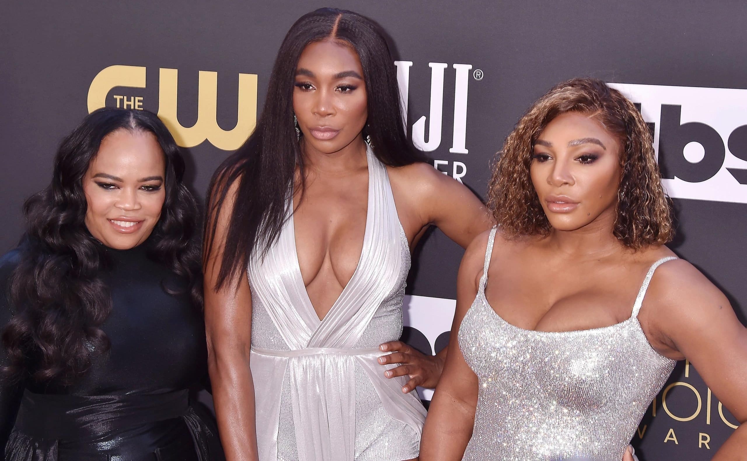 American attorney Isha Price posing with her half-sisters Serena and Venus Williams