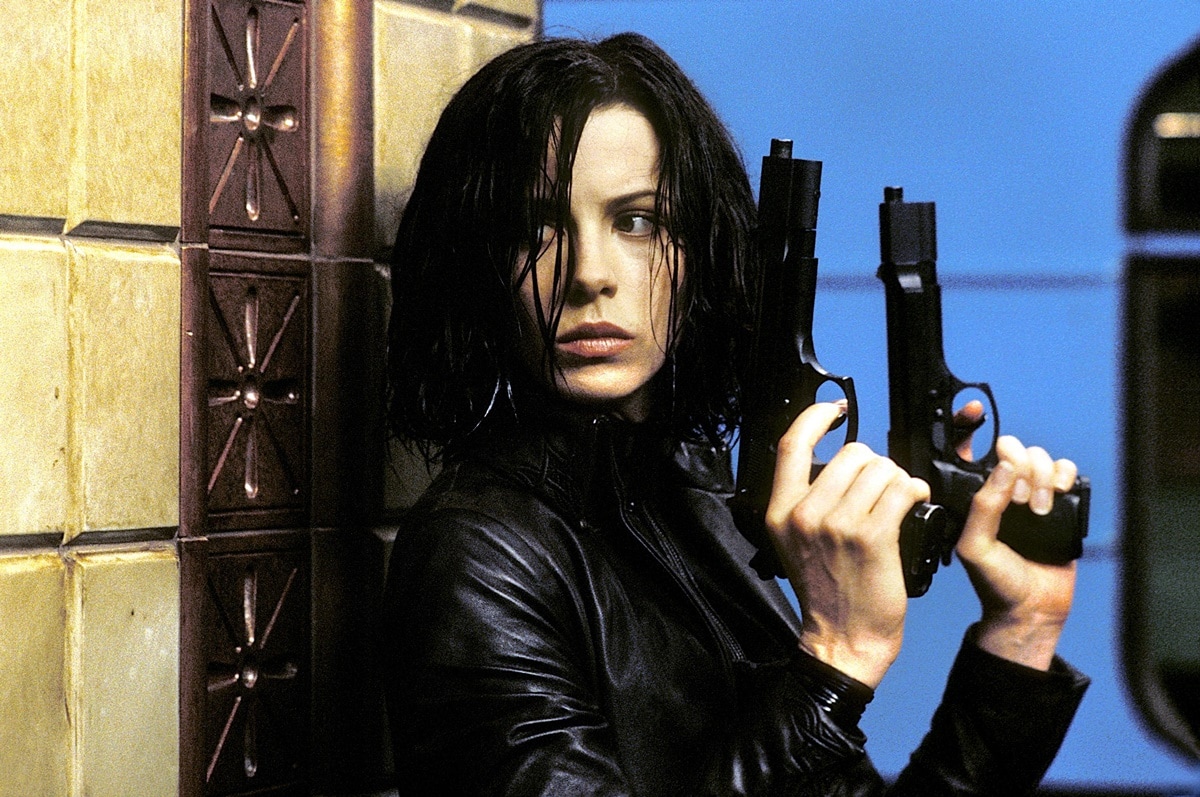Kate Beckinsale as the fierce vampire warrior Selene, wielding dual pistols in an iconic scene from the 2003 action horror film Underworld