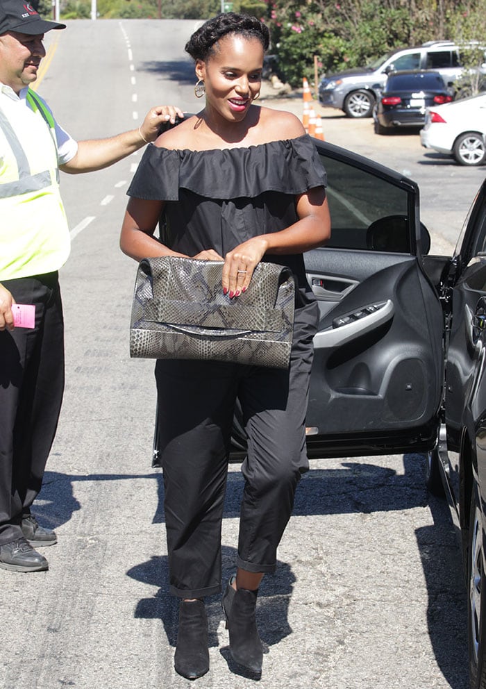 A pregnant Kerry Washington hides her baby bump under a black maternity jumpsuit from Hatch