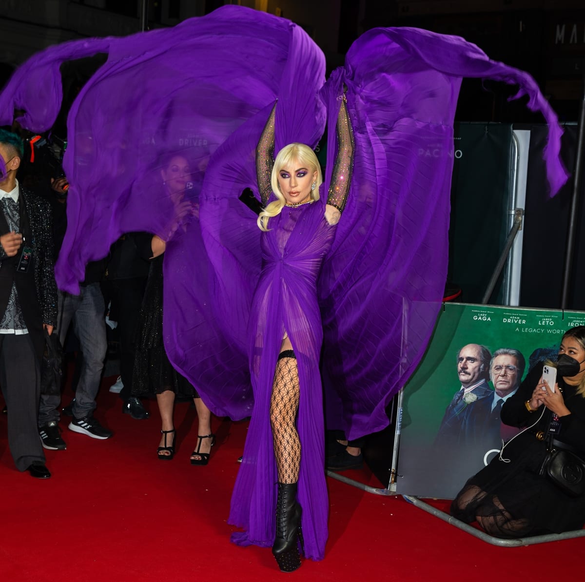 Lady Gaga wears a purple gown at the premiere of her new movie House of Gucci