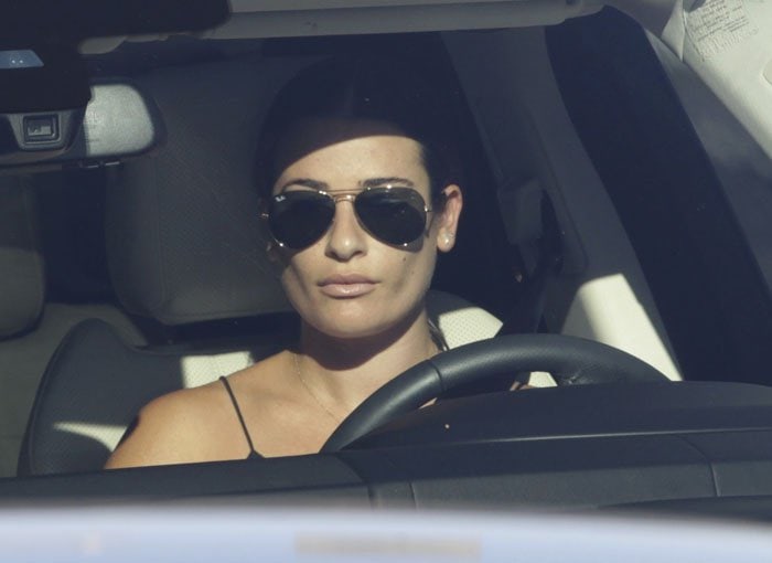 Lea Michele covers her eyes with Ray-Ban aviators as she leaves a massage appointment