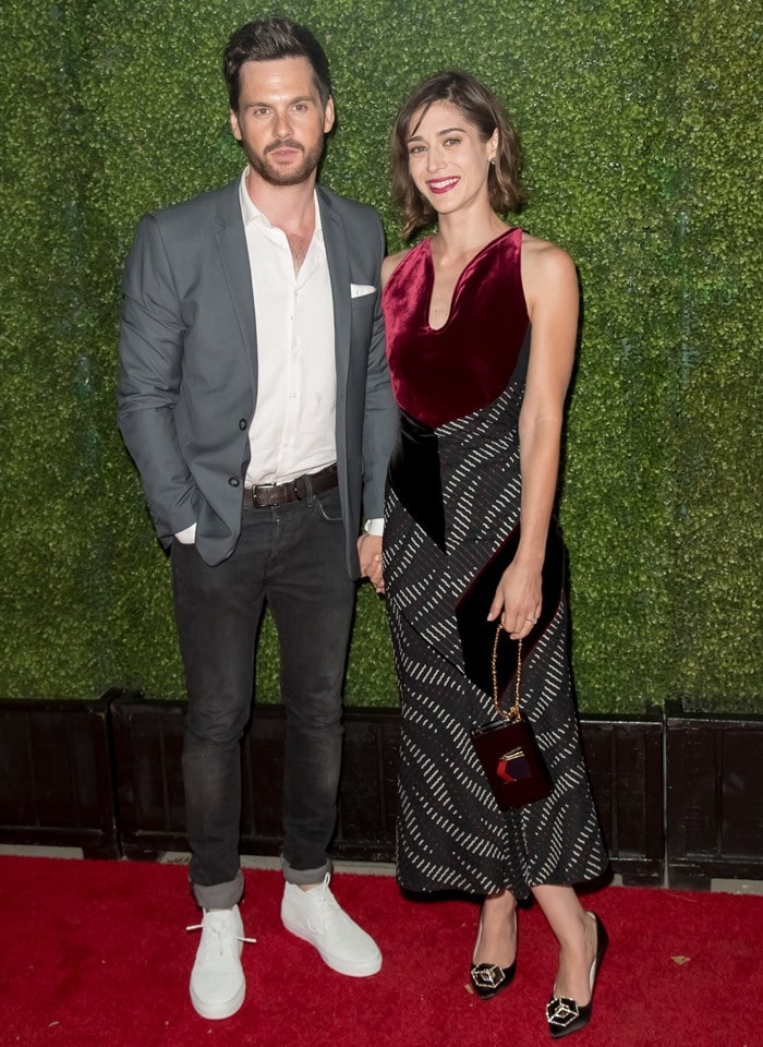 Lizzy Caplan posing with her fiancé, 35-year-old English actor and producer Tom Riley