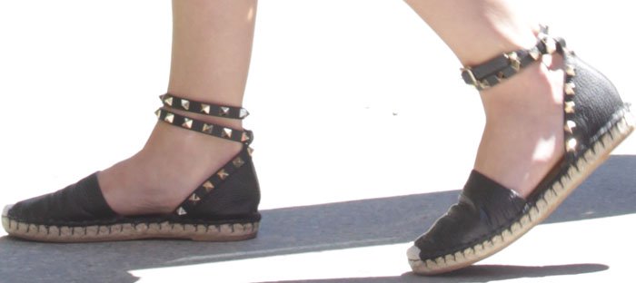 Lucy Hale adds an edgy touch to her casual look with black Valentino "Rockstud" espadrille flats