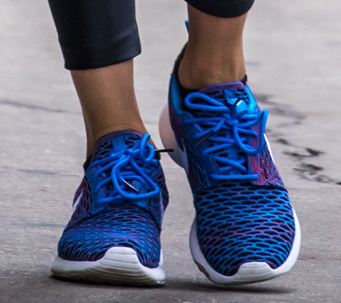 Olivia chose these Nike Roshe One Flyknit sneakers for their comfort and breathable design, making them the ideal choice for her laid-back yet stylish New York City outing