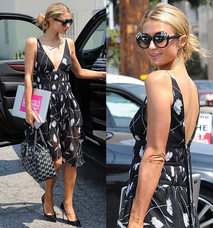 Paris Hilton transformed a simple salon trip into a fashion statement, stopping passersby with her elegant floral-printed black dress, complemented by sleek black pumps