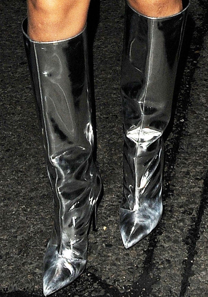 Rihanna stepped out in silver mirrored leather boots by Balenciaga