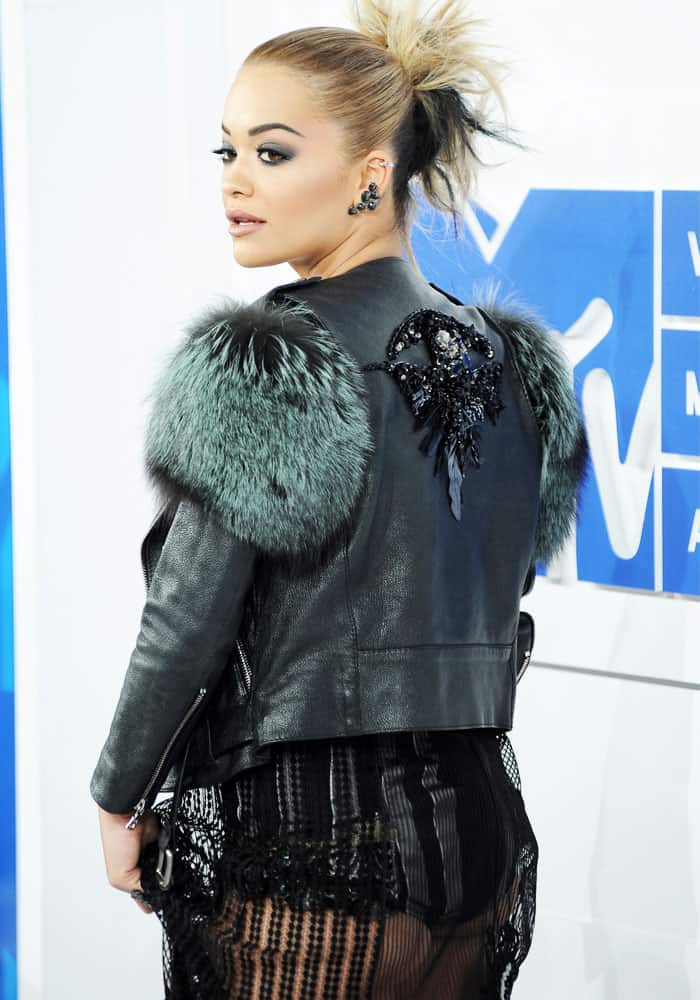 Rita Ora shows off the embellished back of her fur-trimmed leather jacket from Marc Jacobs