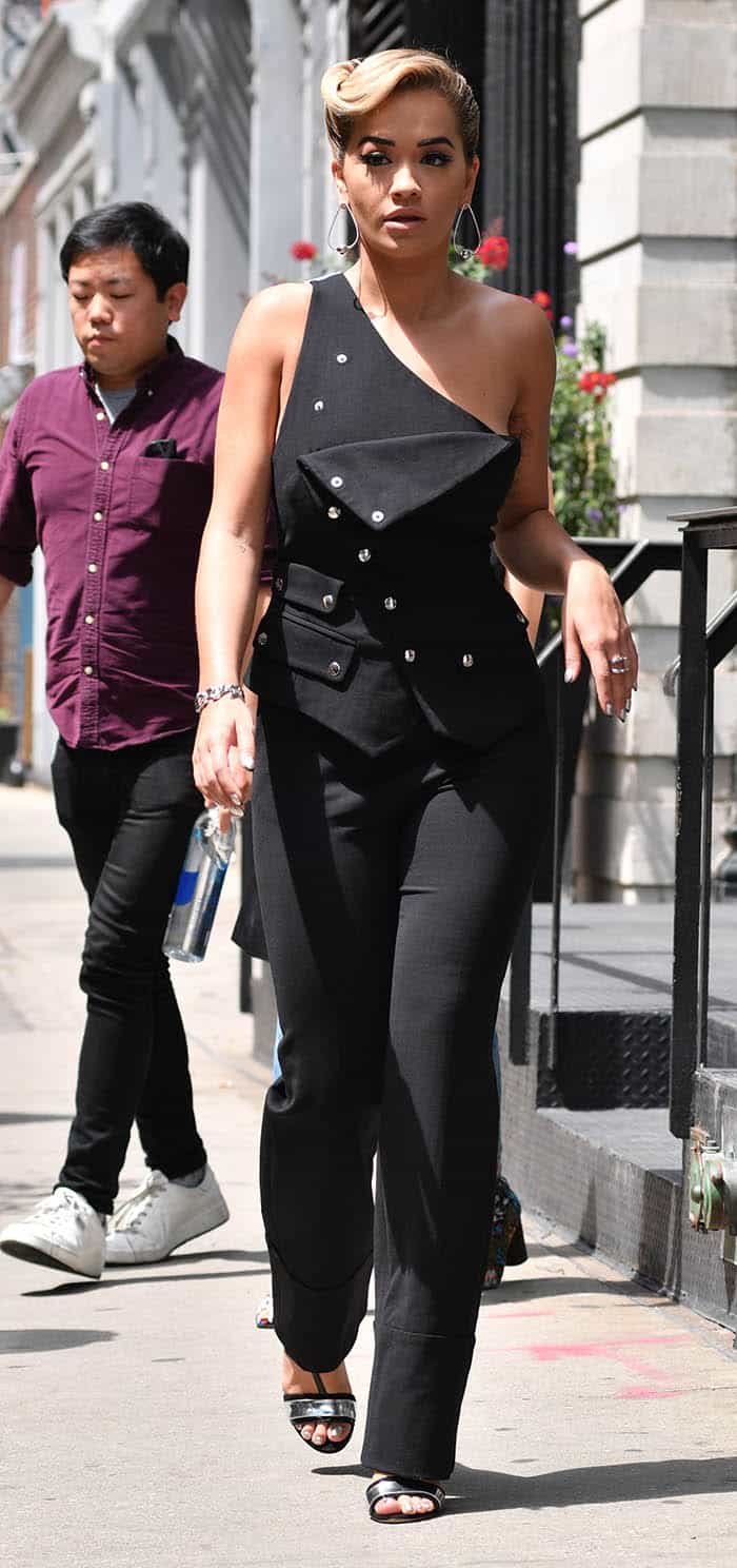 Rita Ora turns heads in a chic Antonio Berardi one-shoulder jumpsuit while strolling through Manhattan