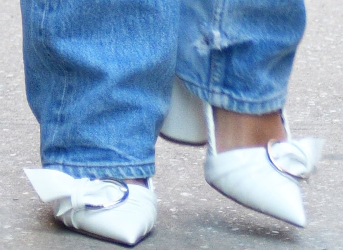 Rita Ora's feet in white buckle-accented pumps from Christian Dior Spring 2016 collection