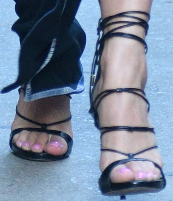 Rita Ora's feet in black leather DSquared2 sandals