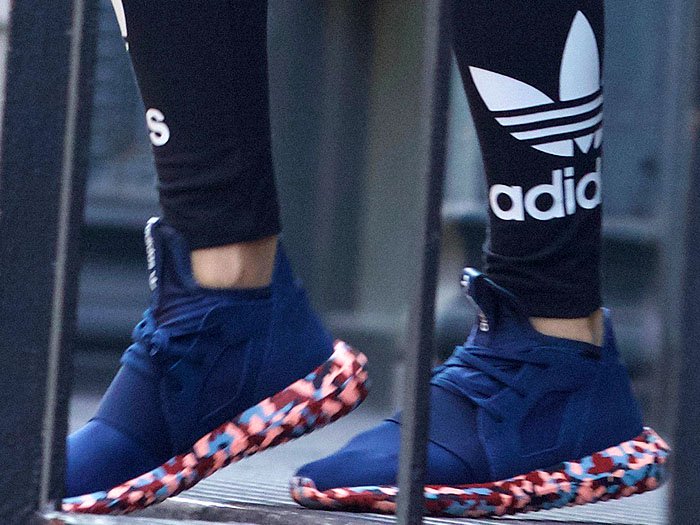 Rita Ora wears navy Adidas sneakers out in New York City