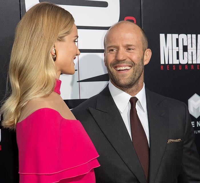 Rosie Huntington-Whiteley and fiancé Jason Statham pose for photos at the "Mechanic: Resurrection" premiere