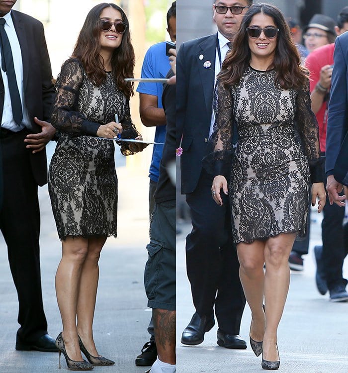 Salma Hayek shows off her legs in a lacy Alexander McQueen mini dress